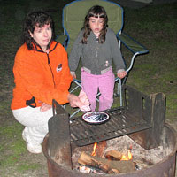 Making popcorn over the campfire