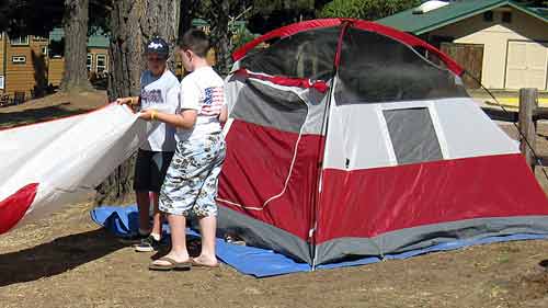 Kids setting up their own tent