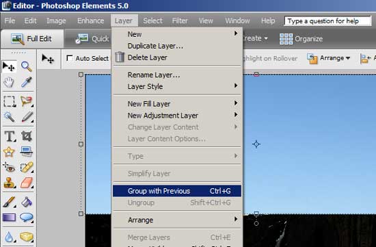 With the blue sky layer selected, click Layer and Group with Previous